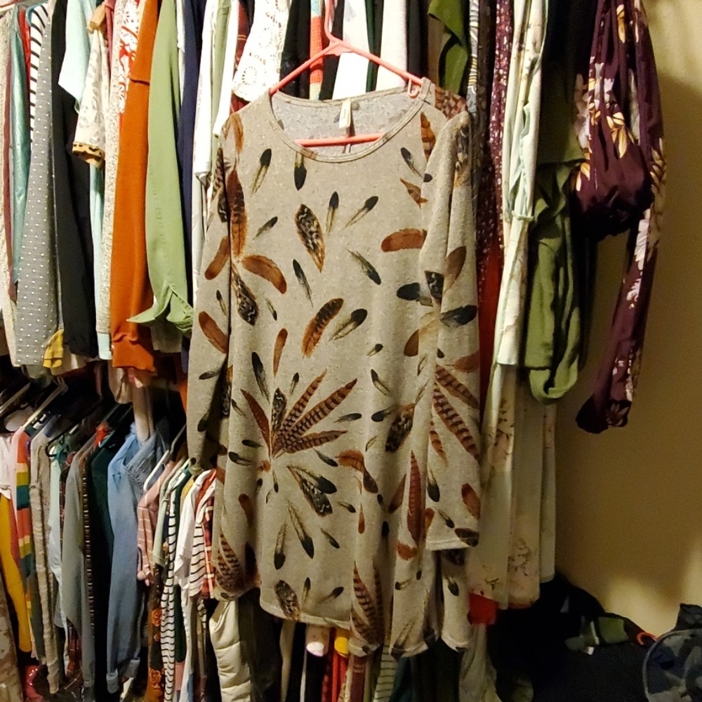 Brand new never warn dress with feathers on it